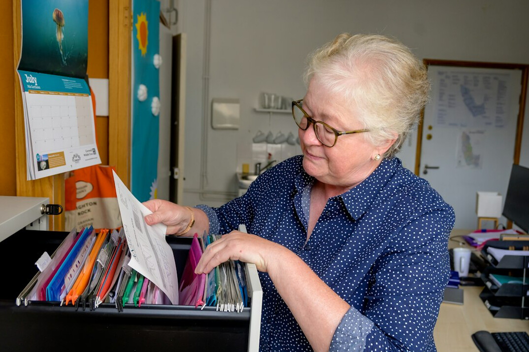 researcher examining documents