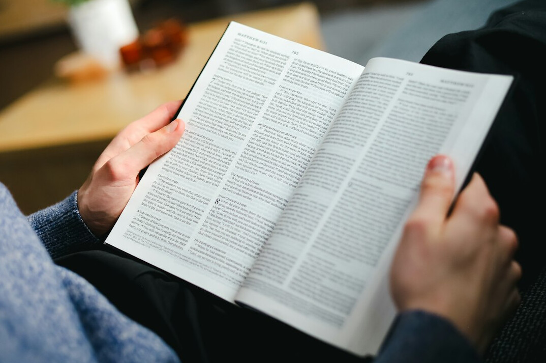 person reading old book